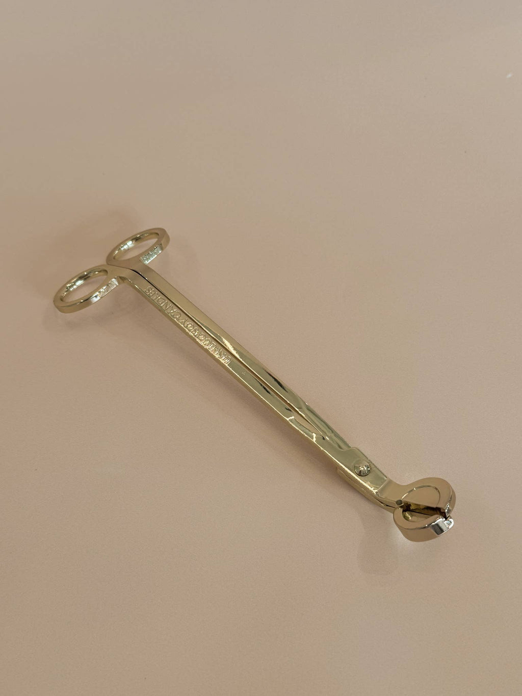 A Gold Wick Trimmer
