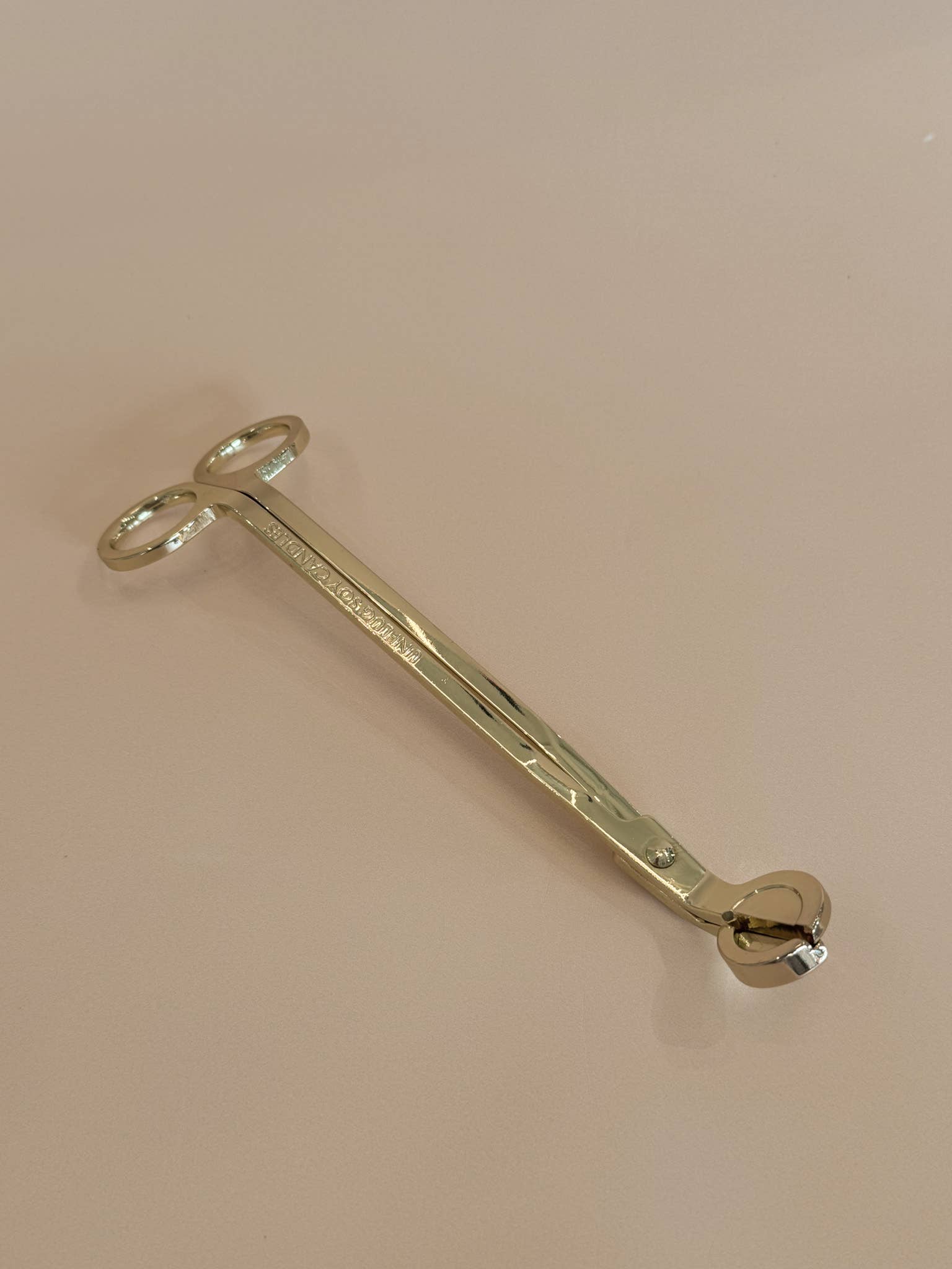 A Gold Wick Trimmer