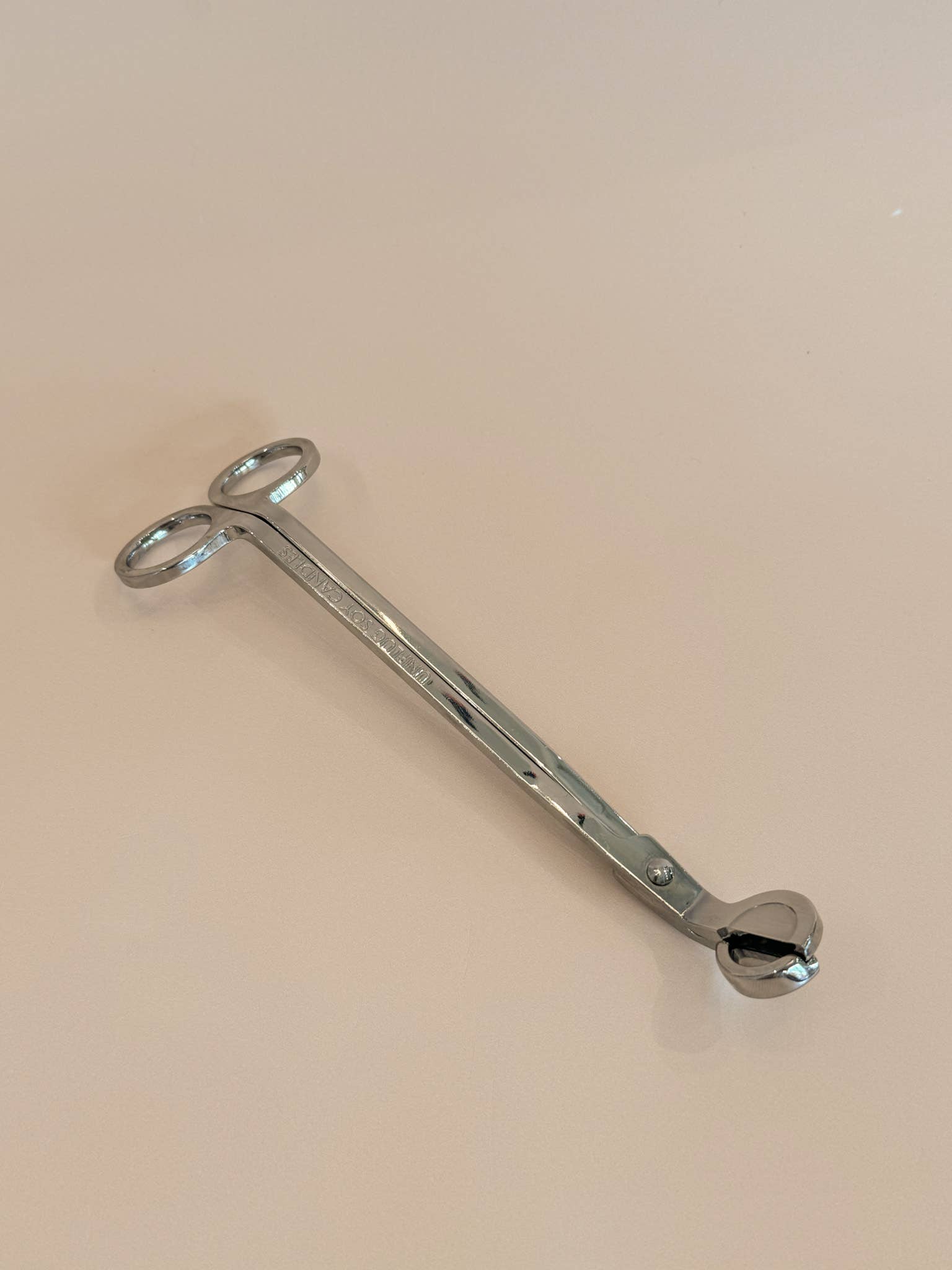 A Gold Wick Trimmer